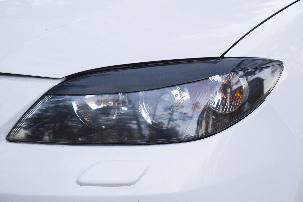 картинка Mazda 3 (седан) I (BK) Рестайлинг 2006 – 2009 Накладки на передние фары (реснички) Вариант 2 от магазина  StreetTuning