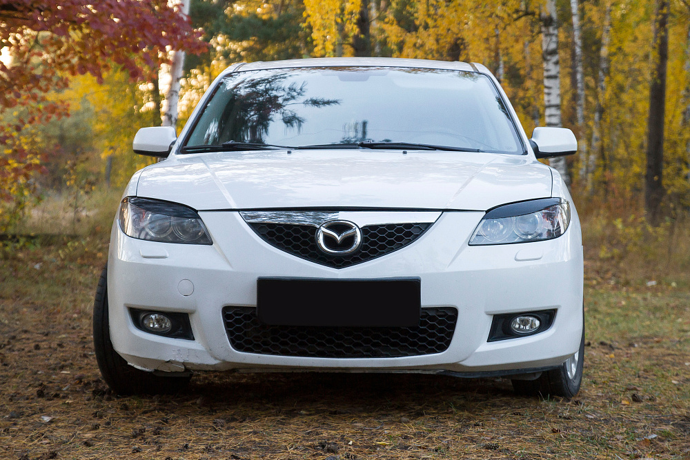 картинка Mazda 3 (седан) I (BK) Рестайлинг 2006 – 2009 Накладки на передние фары (реснички) Вариант 2 от магазина  StreetTuning